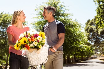 Naklejka premium Happy couple on a bike ride
