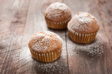 Homemade muffins on a wooden table