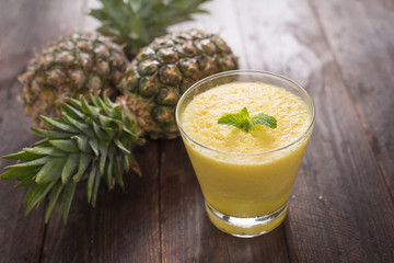 pineapple smoothie on wooden table