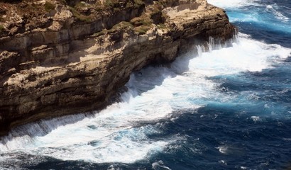 very high cliff on the rough sea with waves