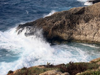 high cliff on the sea with waves