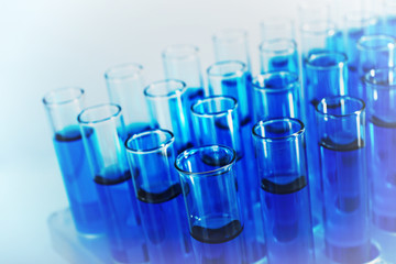 Test-tubes with blue fluid, close-up