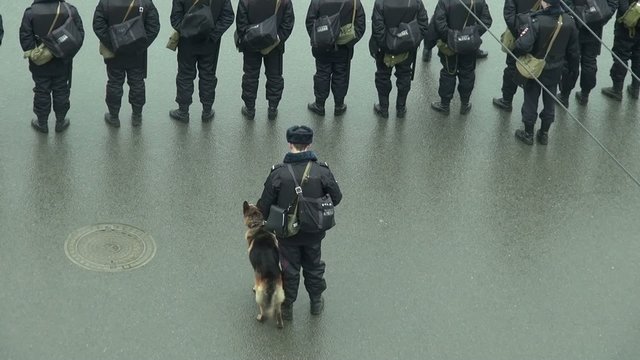 Russian policeman with a service dog