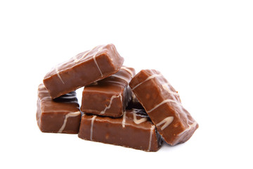 Chocolate candies with nuts on white background.