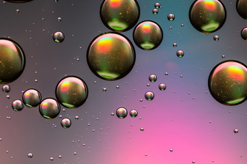 Pink, purple and gold oil and water abstract background