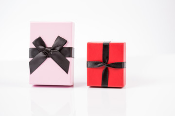 Red and pink gift box on white background isolated