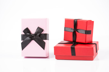 Red and pink gift box on white background isolated