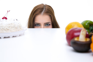  smiling woman holding a shopping bag full of groceries