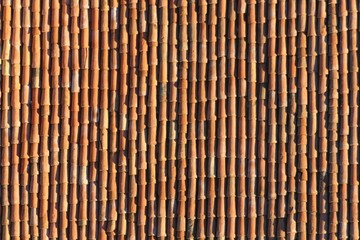 background of terracotta tiles to a roof of an italian house - obrazy, fototapety, plakaty