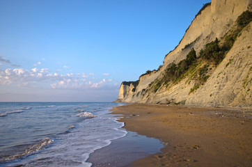 Beach and steep cliffs near Agios Stefanos, Corfu island, Greece