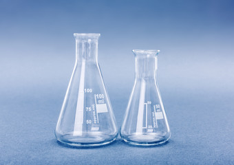 Empty 50 and 100 milliliter Erlenmeyer chemistry flasks