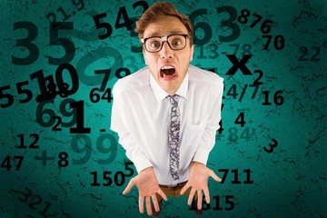 Composite image of geeky businessman gesturing to camera