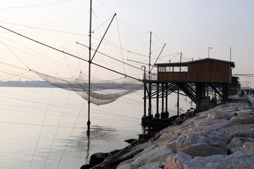 Stilt House overlooking the sea and fishing nets of fishermen