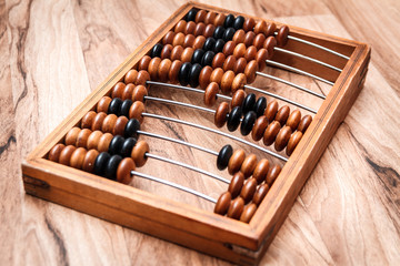 Old vintage abacus on a wooden table