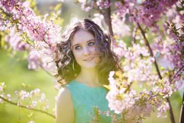 Beautiful young girl in flowers