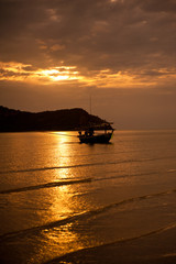 sunset at sea and fishing boat