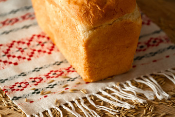 Bread on a linen towel on the wooden table