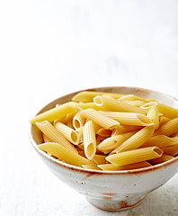Penne pasta in a ceramic bowl