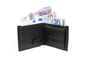 Wallet with euro and pound banknotes with clipping path.