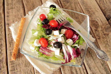 Bowl with fresh vegetable salad