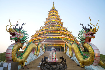 Fototapeta na wymiar Chinese style pagoda in Thai temple under twilight sky