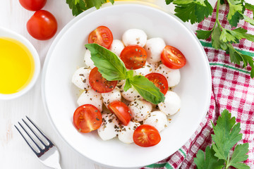 traditional salad with mozzarella and cherry tomatoes, top view