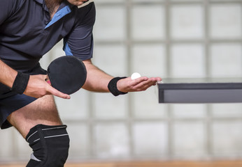 table tennis player serving