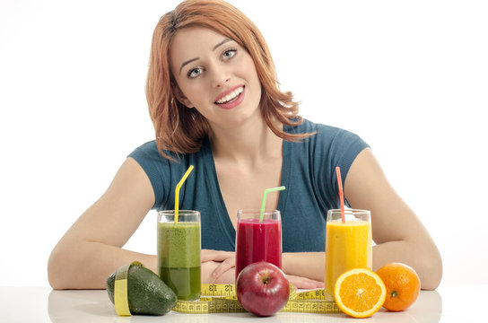 Happy woman having a table full of organic food,juices,smoothie