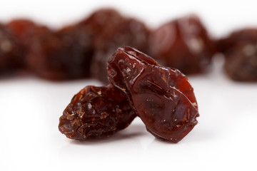 Pile of healthy raisins isolated on white background