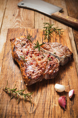 Fiorentina steak grilled with spices and vegetables on a rustic