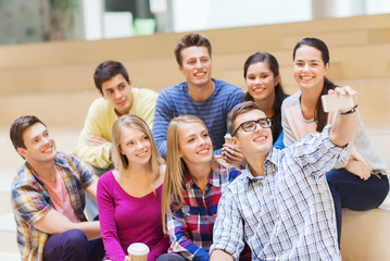 group of students with smartphone and coffee cup