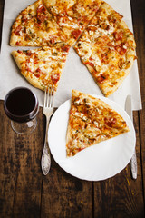 pizza and glass of wine on a table