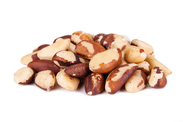 Five big, beautiful, Brazilian walnut on a white background.