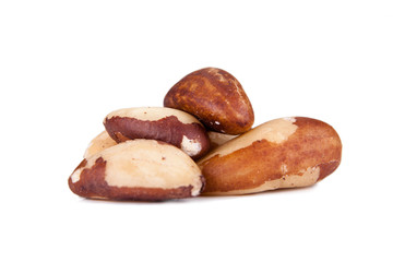 Five big, beautiful, Brazilian walnut on a white background.