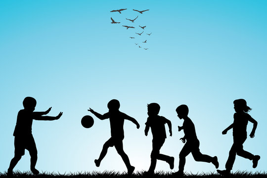 Children silhouettes playing football