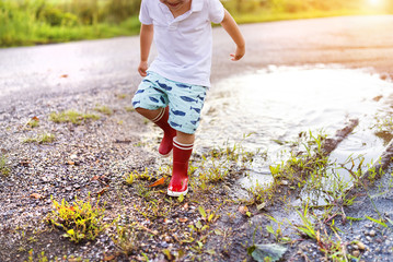 Boy in a puddle