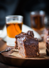 Homemade chocolate brownies with nuts and ganache