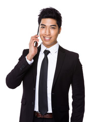 Mixed Indian businessman talk to mobile phone