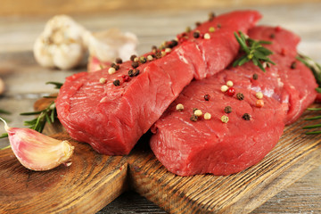 Raw beef steak with rosemary and garlic