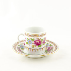 Porcelain tea and coffee cup with flower motif