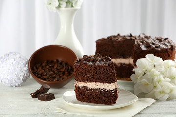 Delicious chocolate cake on table on light background