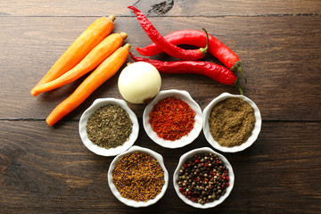 Different kinds of spices in bowls close-up,
