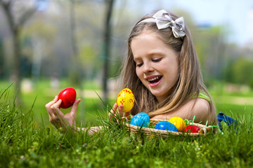 Child find easter egg outdoor.