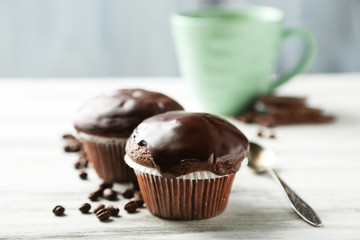 Tasty homemade chocolate muffins and cup of coffee