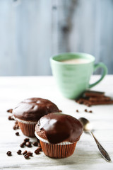 Tasty homemade chocolate muffins and cup of coffee
