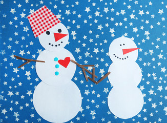 Handmade snowmen on bright background