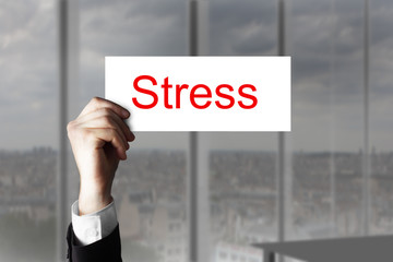 businessmans hand holding up sign stress