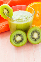 Healthy diet fruit juice kiwi orange wooden table