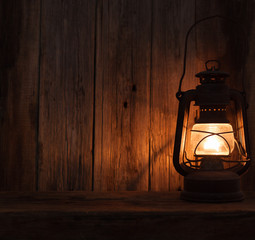 lantern lamp light dark wooden wall table background © izuboky