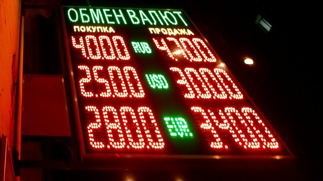 inflation, currency exchange rate on red led display, screen panel on russian language, Ukraine